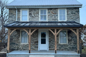timber frame porch on old stone house